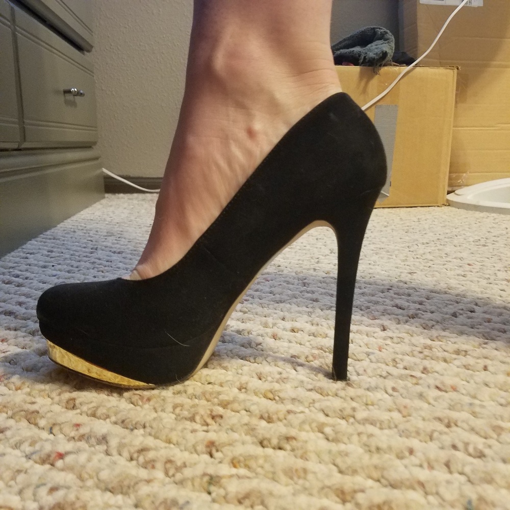 Black and gold pumps